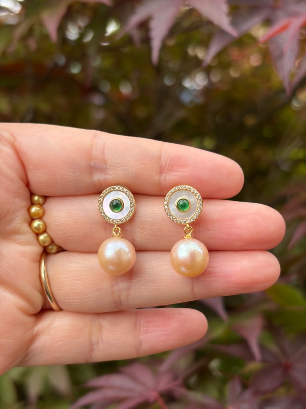 S925 Genuine Freshwater Peach Pearl Drop Earrings with Green emerald accents.